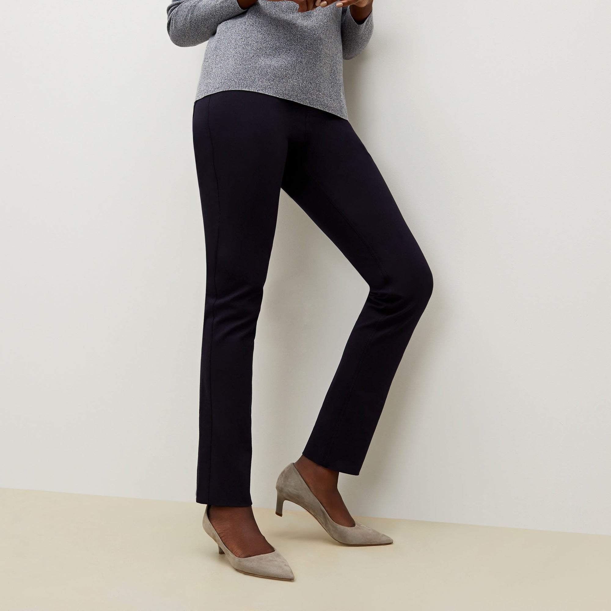 Side image of a woman standing wearing the Hockley pant in ink | Exclude
