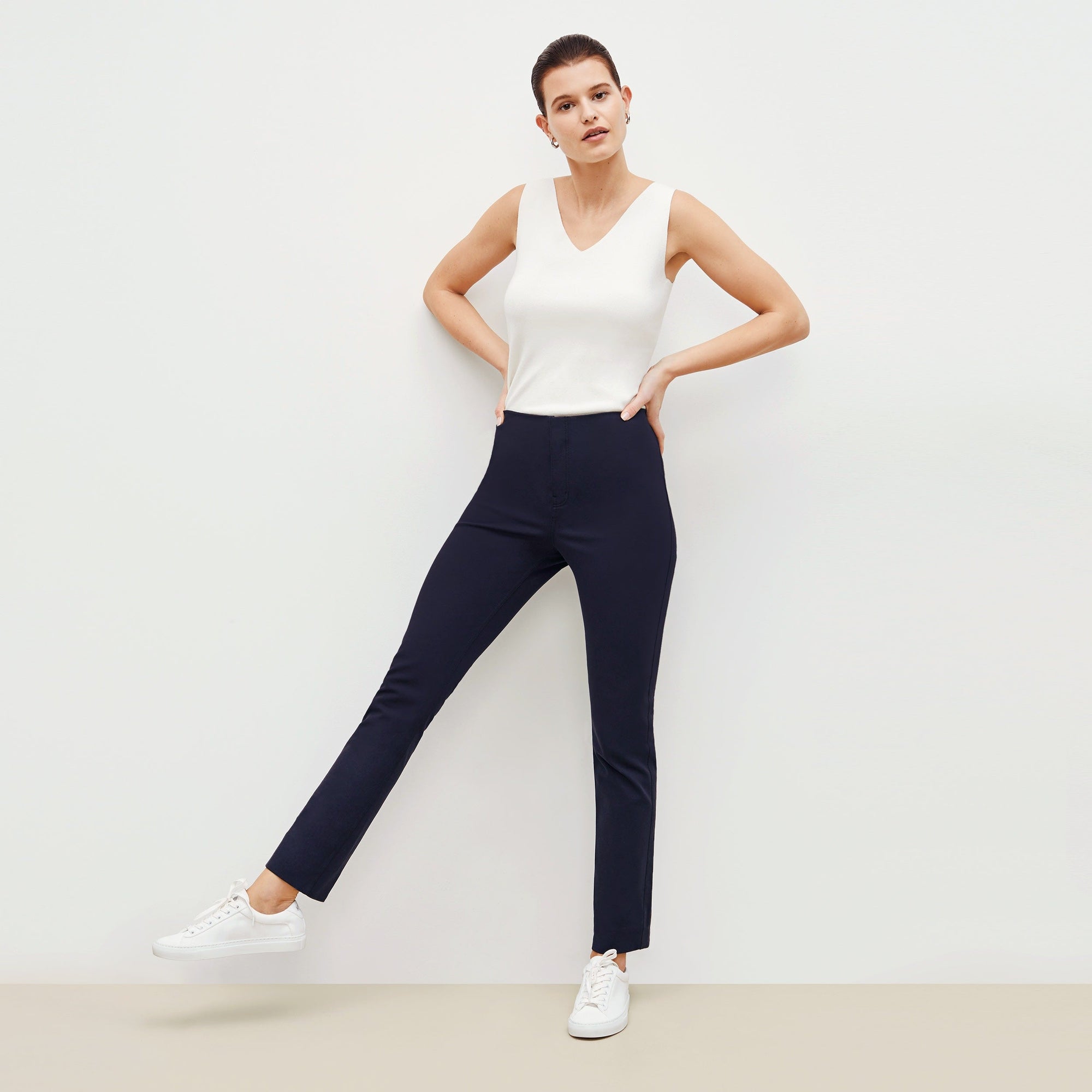 Front image of a woman standing wearing the Hockley pant in ink | Exclude