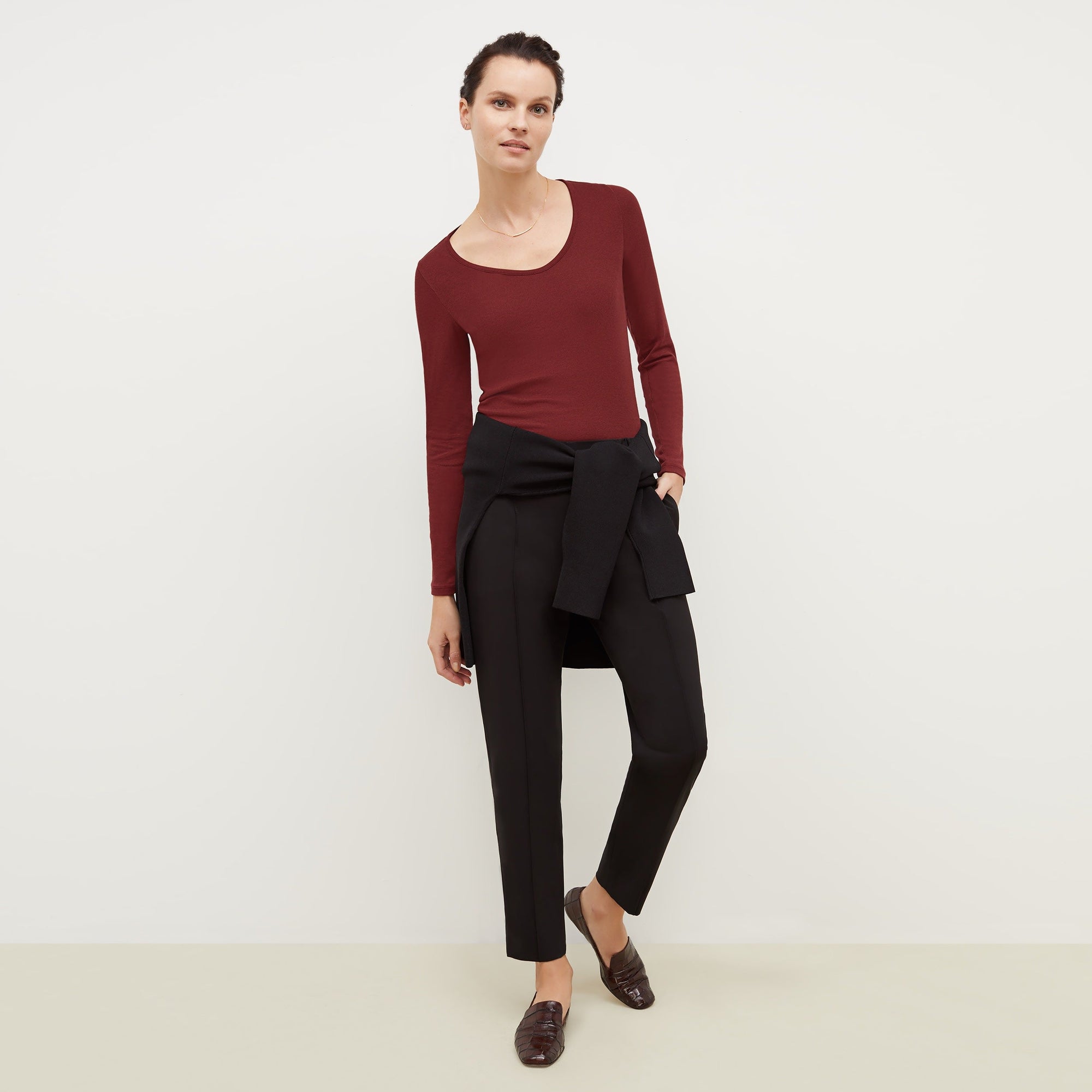 Front image of a woman standing wearing the Colby Jogger in Black | Exclude