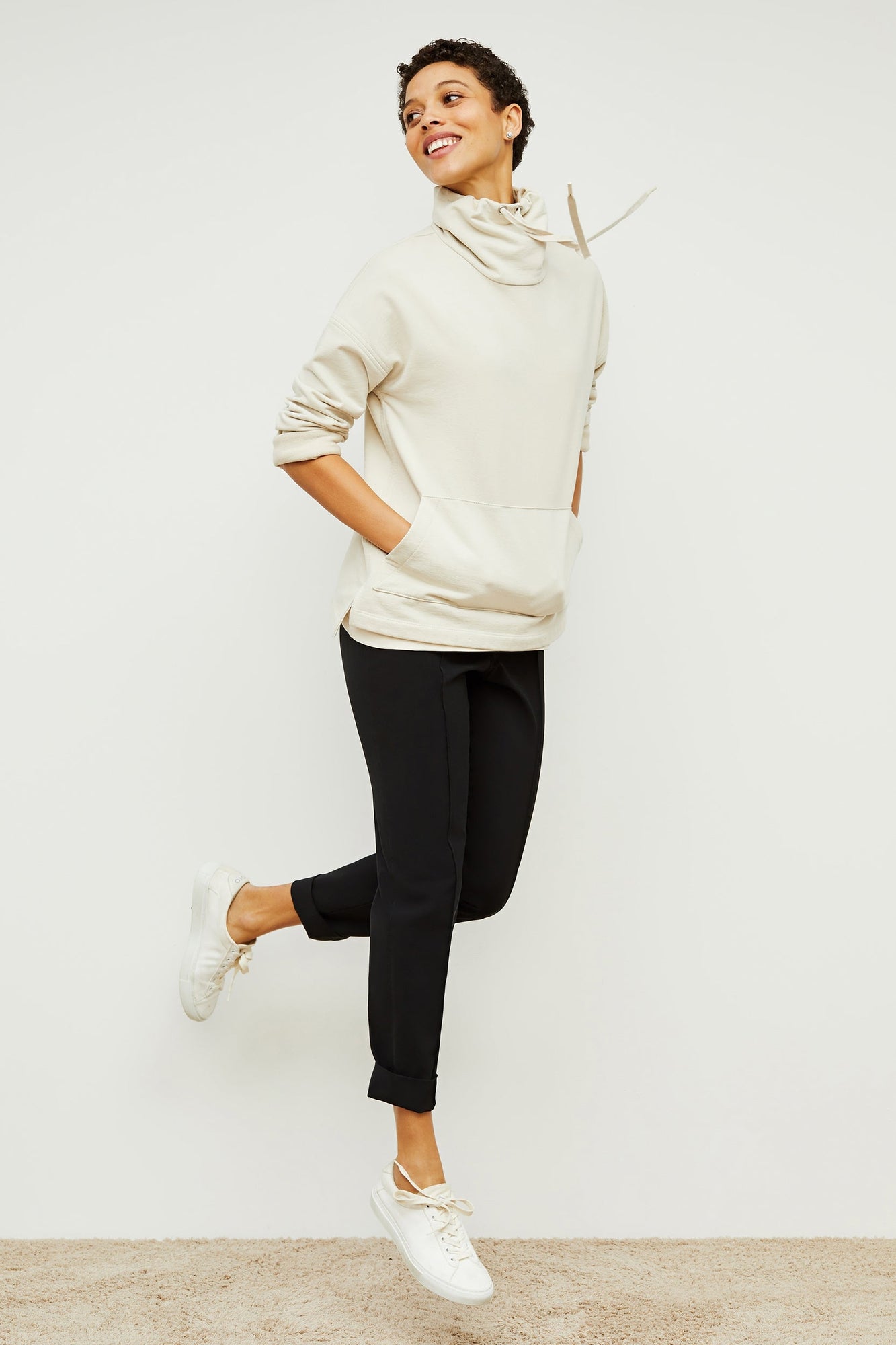 Front image of a woman standing wearing the Colby Jogger in Black | Exclude