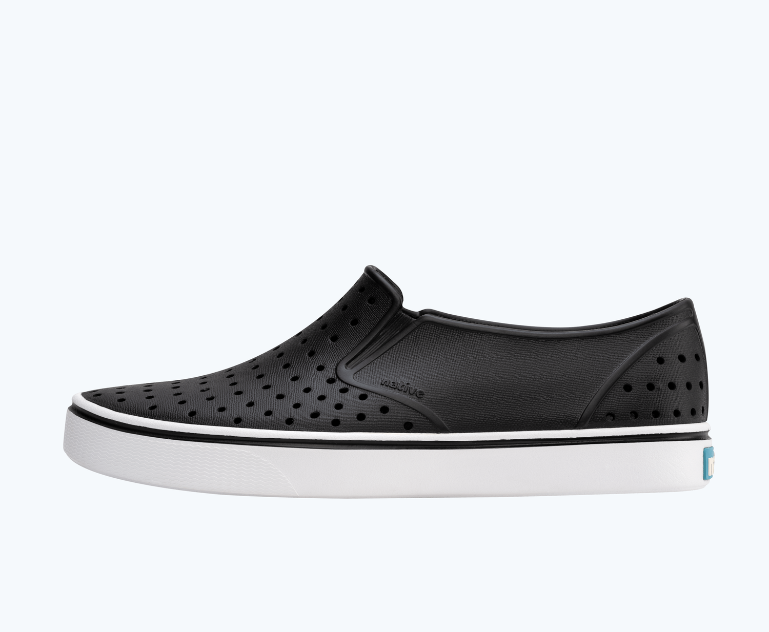 Side view of a Native Shoes Adults Miles | Jiffy Black/ Shell White Footwear