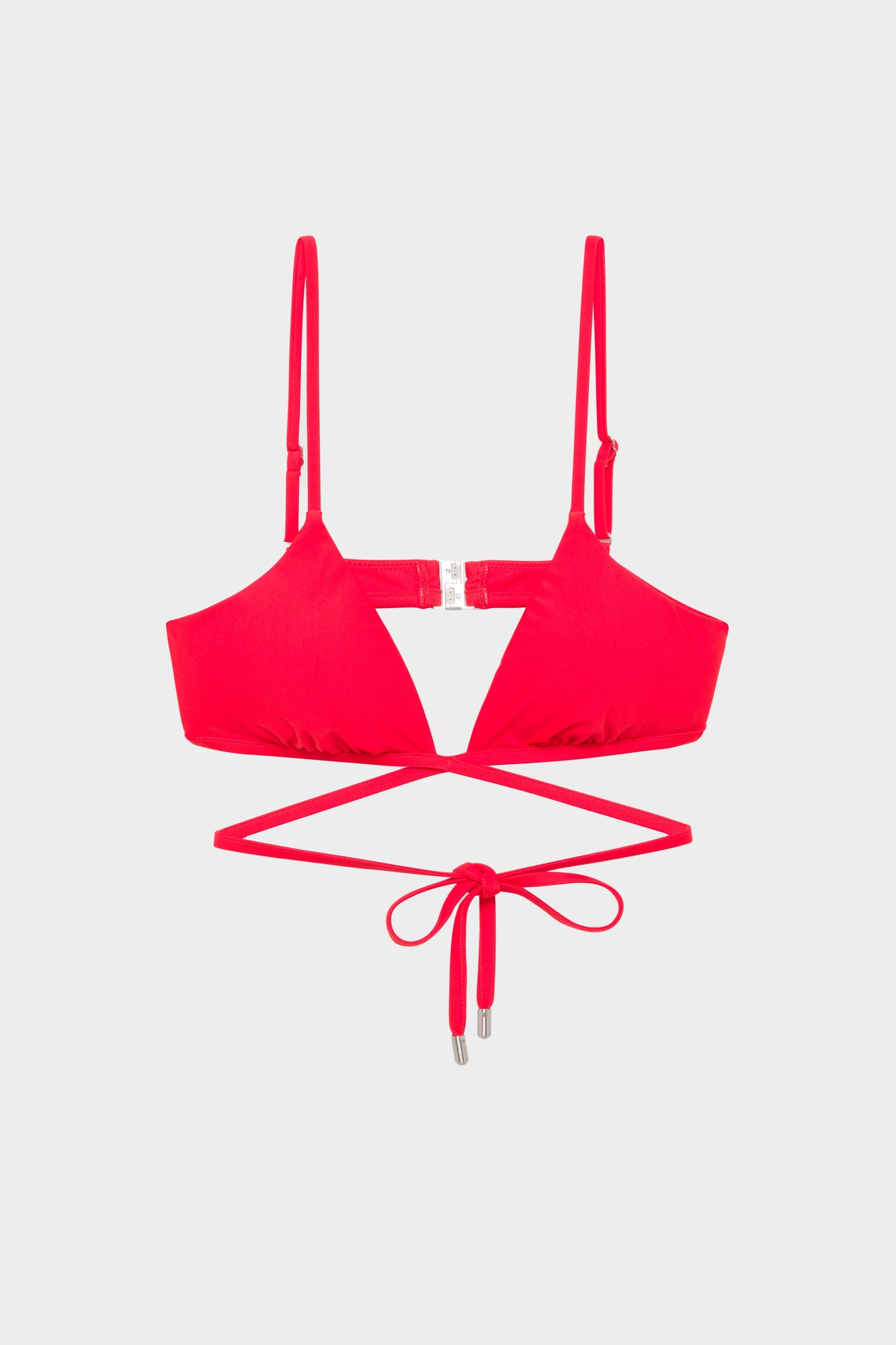 Bright red bikini top with adjustable straps, center clasp, and tie-front cutout detail.