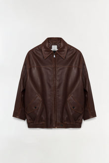 Brown leather jacket with oversized fit, collared neckline, front zip closure, and patch pockets.