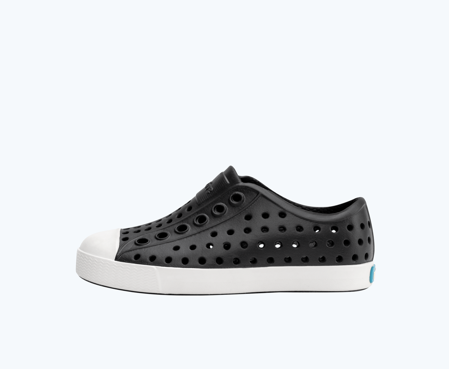 Side view of a Native Shoes Kids Jefferson Kids | Jiffy Black/ Shell White Footwear