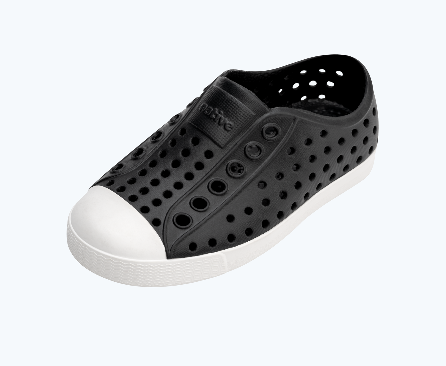 Angled view of a Native Shoes Kids Jefferson Kids | Jiffy Black/ Shell White Footwear