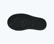 Bottom view of a Native Shoes Kids Jefferson Block Kids | Jiffy Black/ Shell White/ Peace Alien Block Footwear