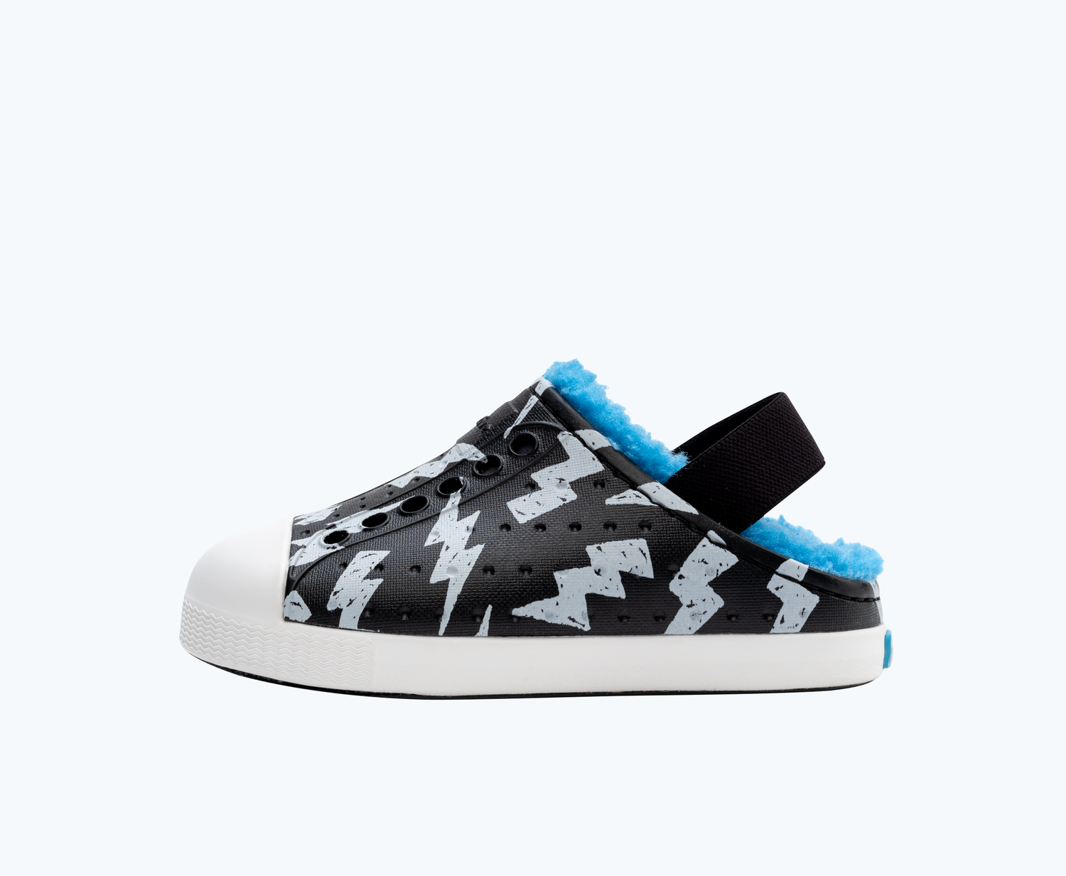 Side view of a Native Shoes Kids Jefferson Cozy Glow Kids | Jiffy Black/ Shell White/ Shell Lightning Glow Footwear