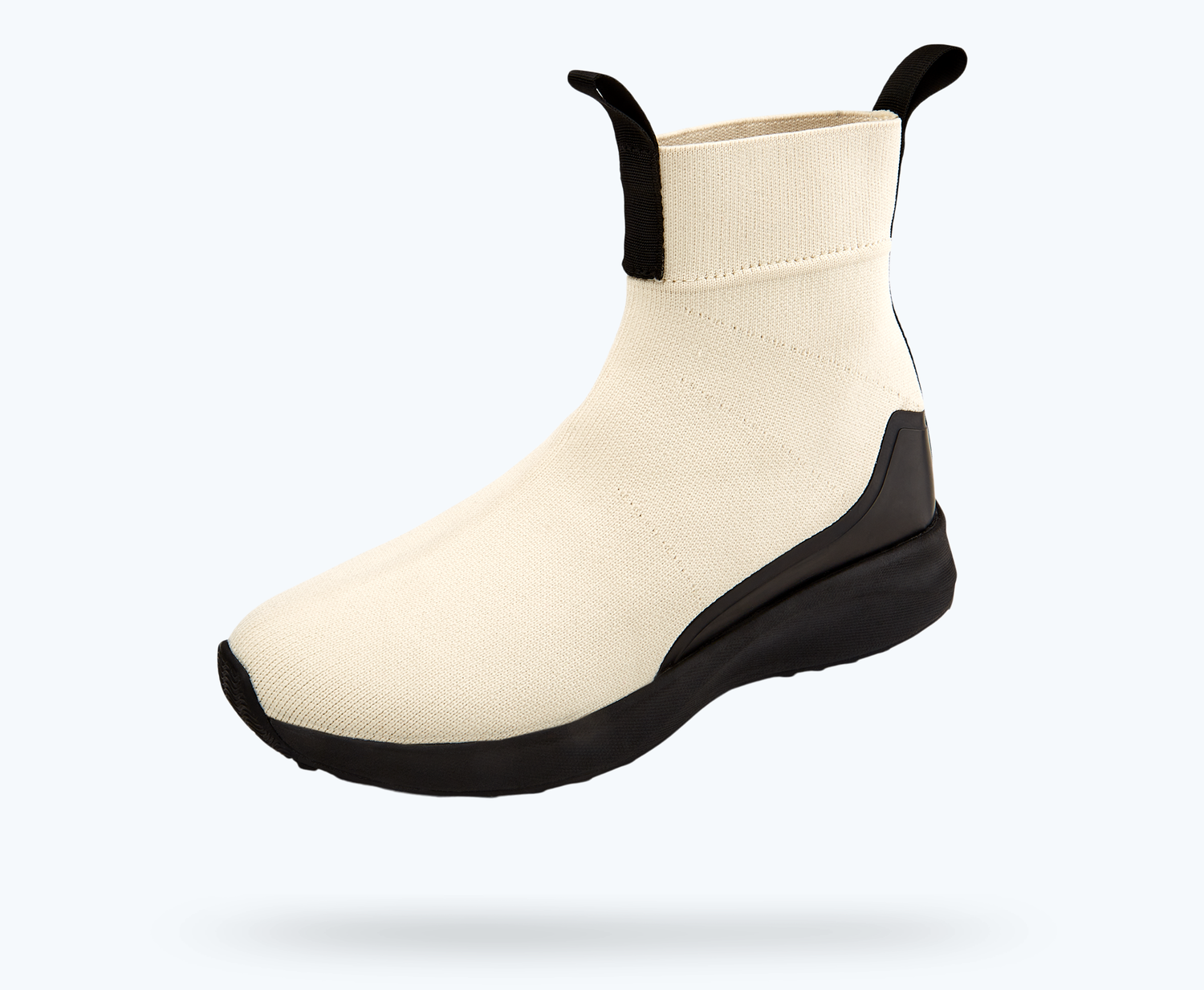 Angled view of a Native Shoes Nova Hydroknit | Bone White/ Jiffy Black/ Jiffy Rubber Footwear