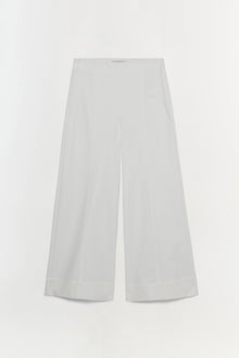 White cotton cropped pants with wide-leg silhouette and center front pleats.