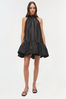 Black sleeveless mini dress with halter neckline, gathered waist, and voluminous taffeta skirt.