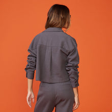 Back view of model wearing the bonded thermal shirt in faded black.