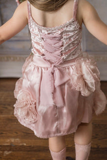 Back view of blush pink girls velvet dress with lace up back and satin bow