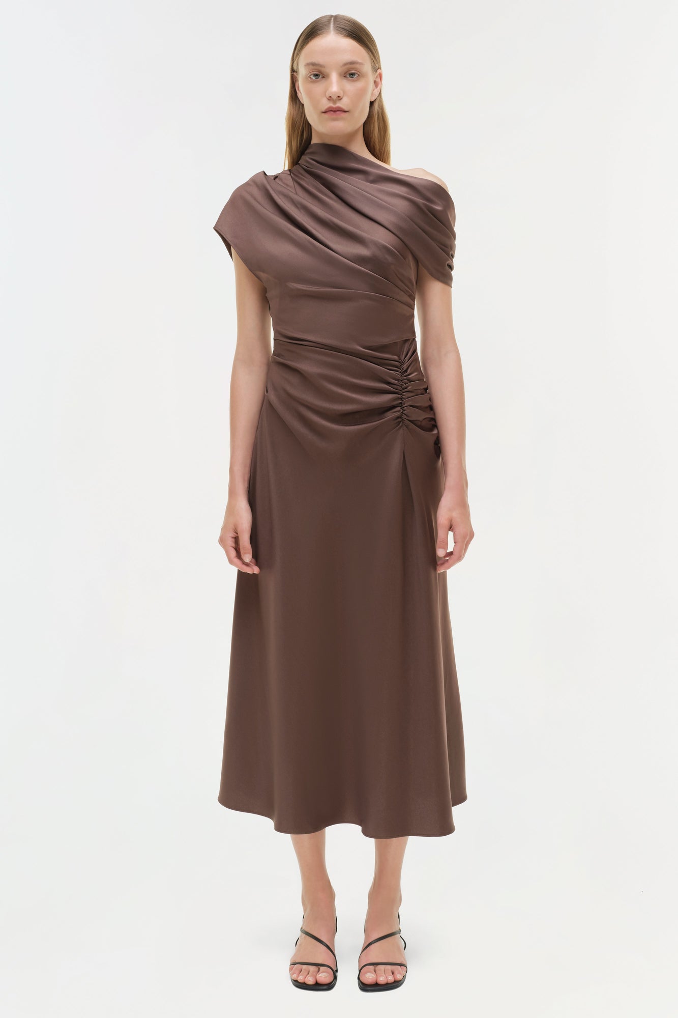 Brown satin midi dress with asymmetrical draped neckline and ruched side detail.