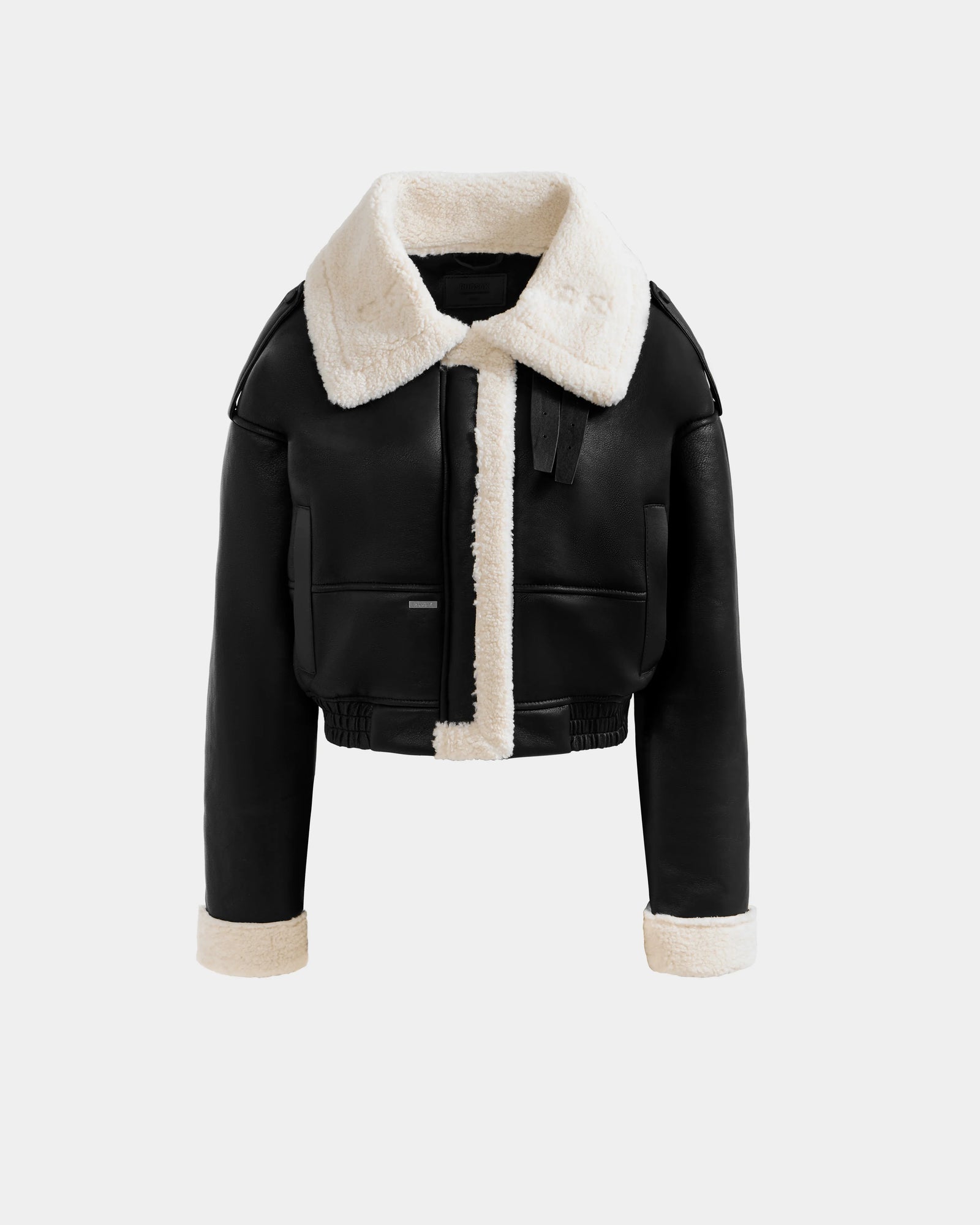 The APRIL - L125517 Black by Rudsak is a black cropped aviator jacket with a wide cream shearling collar, matching cuffs, front trim, front pockets, and a belted collar detail.
