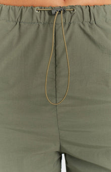 Close-up of the khaki cargo pants elasticated waist with a drawcord and grey toggle