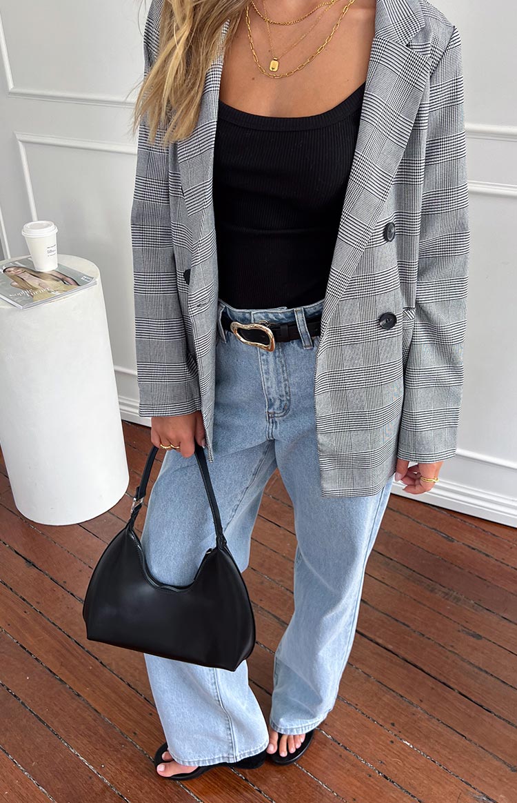 Grey and white plaid double-breasted blazer with notched lapels and dark buttons