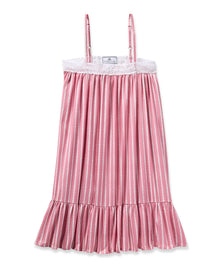 The Girls Twill Lilly Nightgown in Love Lines by Petite Plume is a pink and white striped sleeveless dress, made from yarn-dyed cotton. It features thin straps, lace detailing at the top, a ruffled hem, a luxurious sleepwear feel, and a front label near the neckline.