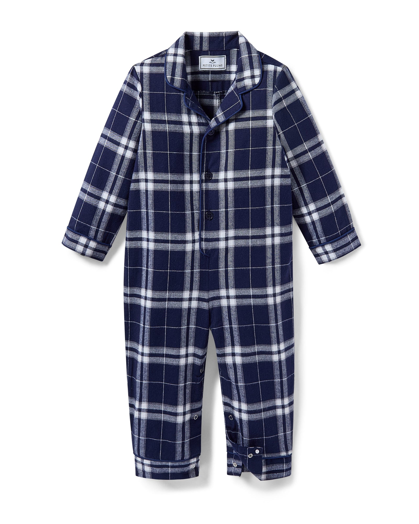 The Baby's Brushed Twill Classic Romper in Oxford Tartan is a full-length, long-sleeve children's onesie featuring a navy, white, and gray plaid pattern with a button-up front, collar, and snap leg closures.