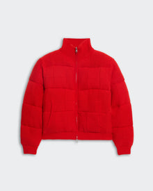 Red insulated quilted puffer jacket with square grid stitching, front pockets, ribbed turtleneck, and zip closure.