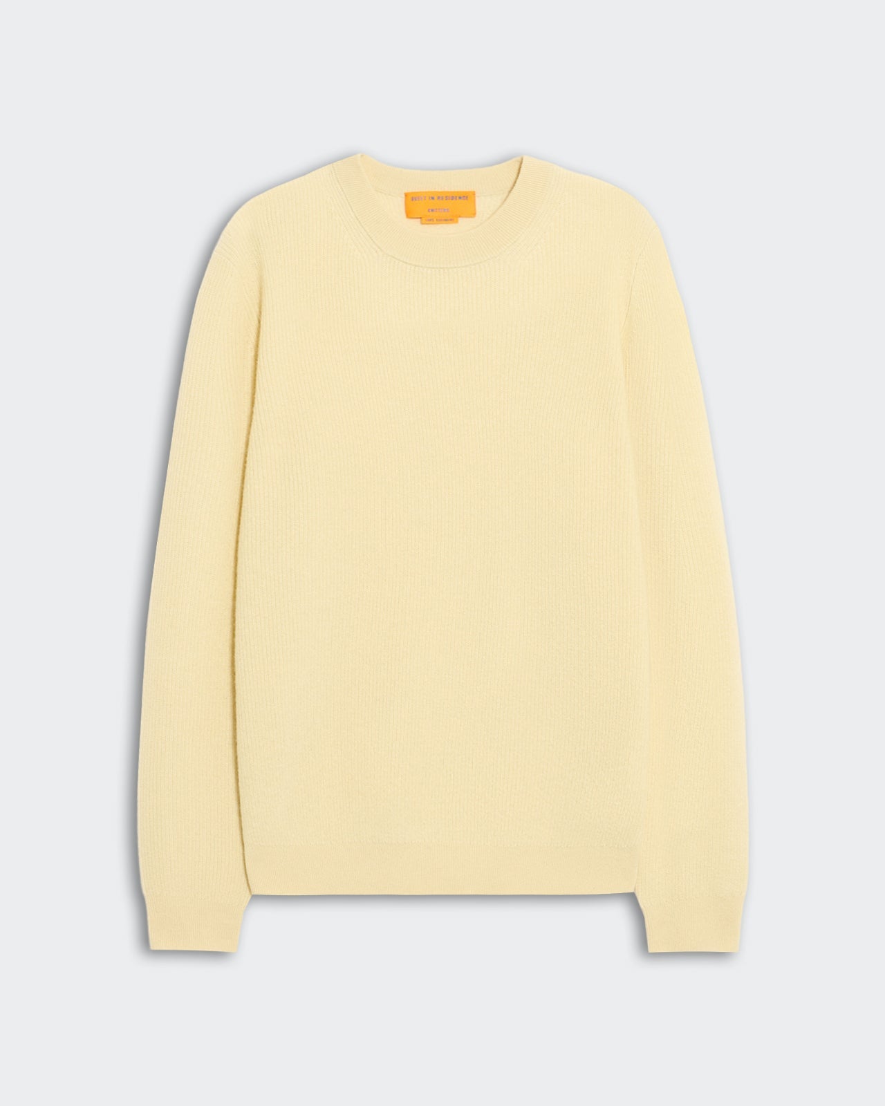 Light cream ribbed knit sweater laid flat on a neutral background featuring a classic crewneck and long sleeves, labeled Rib Allday Crew - Mist.