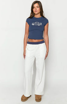 Front view of cream wide-leg track pants with a navy contrast elastic waistband