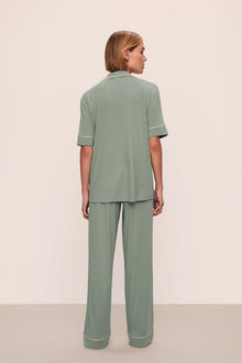 Model is wearing Gisele TENCEL Modal Short Sleeve & Pant PJ Set in Eucalyptus/Ivory