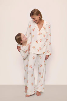 Model is wearing Gisele Printed TENCEL Modal Long PJ Set in  Floral Bloom Ivy/Vanilla Cream with kids' model in Kids Printed TENCEL Modal Unisex Long PJ Set in  Floral Bloom Ivy/Vanilla Cream
