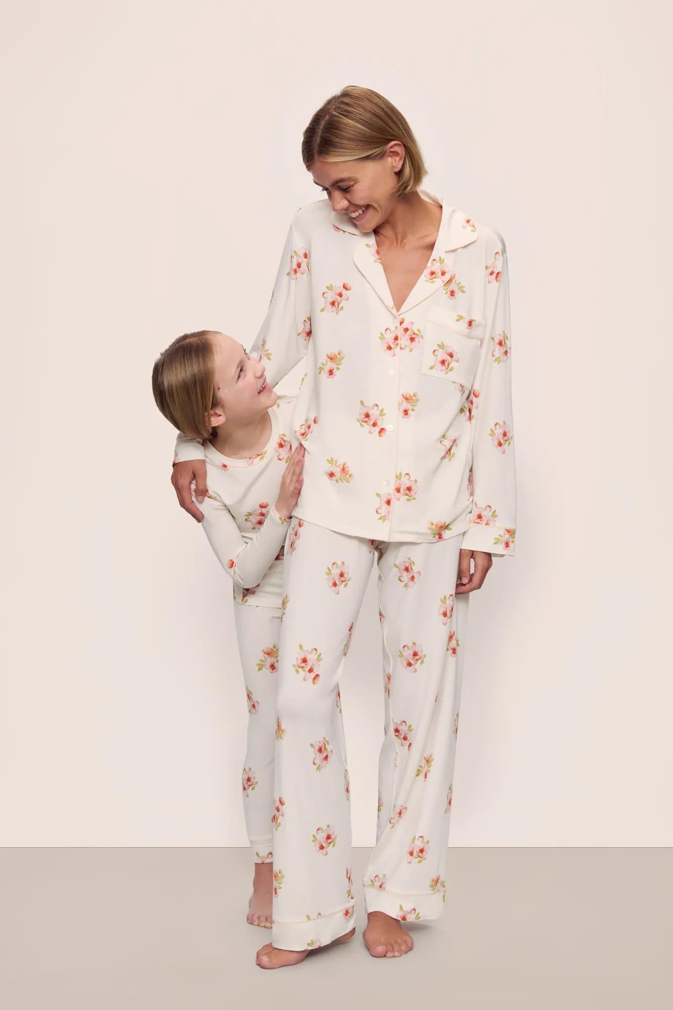 Model is wearing Gisele Printed TENCEL Modal Long PJ Set in  Floral Bloom Ivy/Vanilla Cream with kids' model in Kids Printed TENCEL Modal Unisex Long PJ Set in  Floral Bloom Ivy/Vanilla Cream