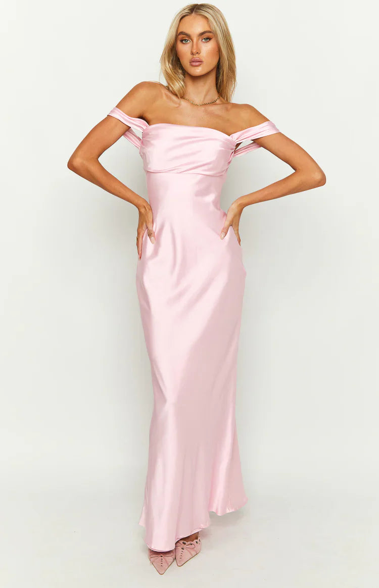 Full-length front view of a light pink satin off-shoulder maxi dress with a draped bodice and flowing skirt