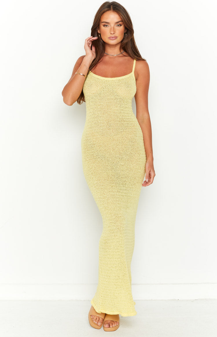 Full length front view of a yellow crochet knit bodycon maxi dress with thin spaghetti straps and scoop neckline