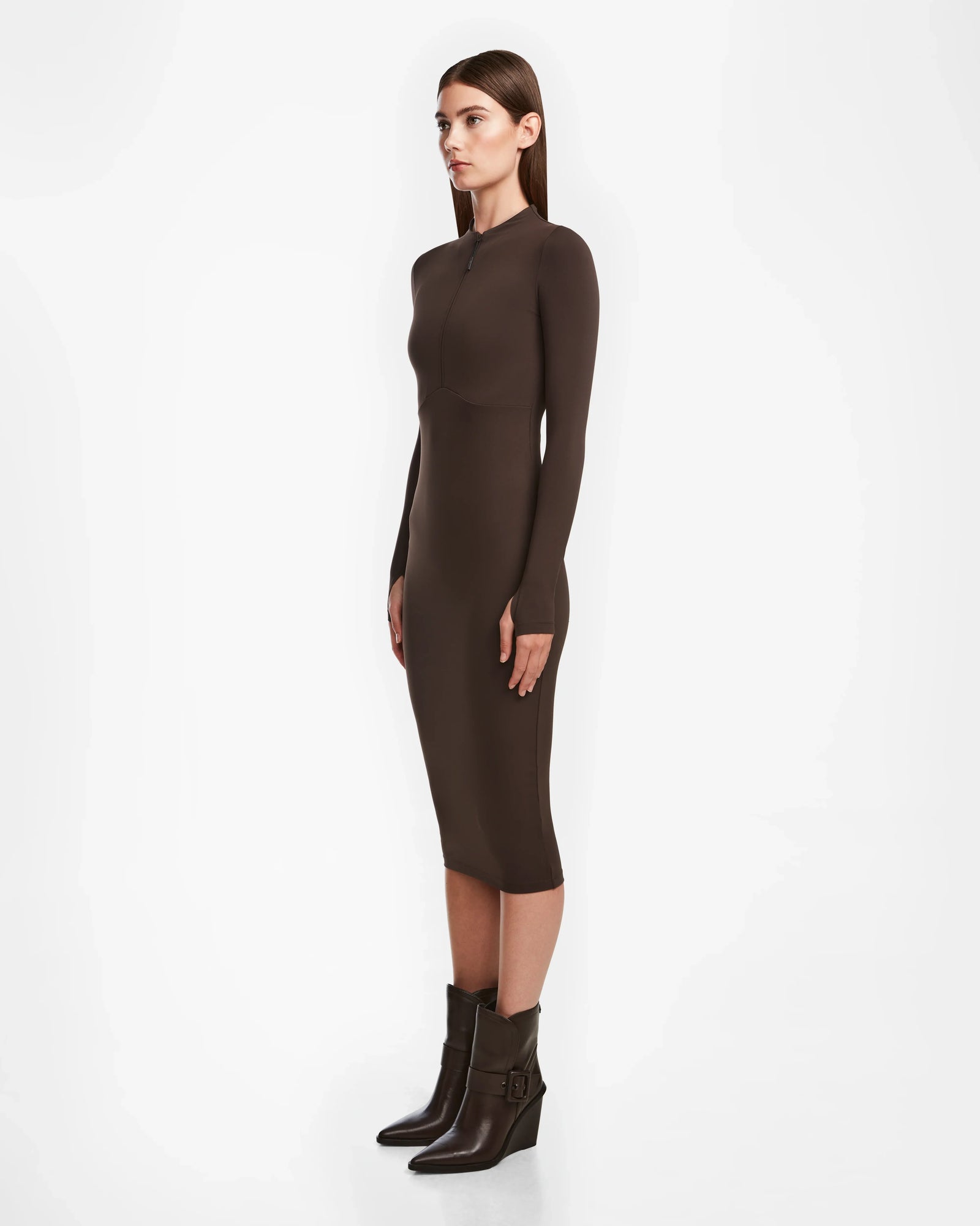 A woman in the AGNES - 8524551 Espresso zip-up dress by Rudsak.