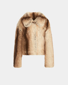 The Rudsak JOSILYN - 8124792 Mocha is a cropped women’s faux fur jacket in light brown and tan, featuring a wide collar and plush texture—ideal for winter. Shown against a plain white background.