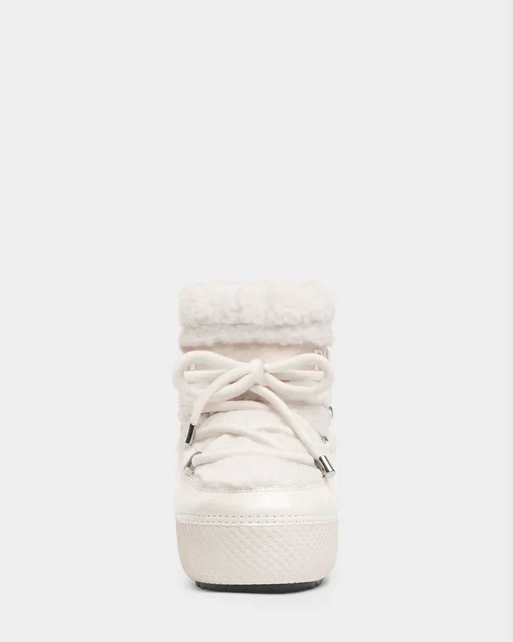 Front view of the KATHY - 8223513 Iceland women's winter boot by Rudsak, featuring a textured sole, fluffy faux shearling collar, and bow-tied laces. Cozy and lined, it's perfect for cold weather.