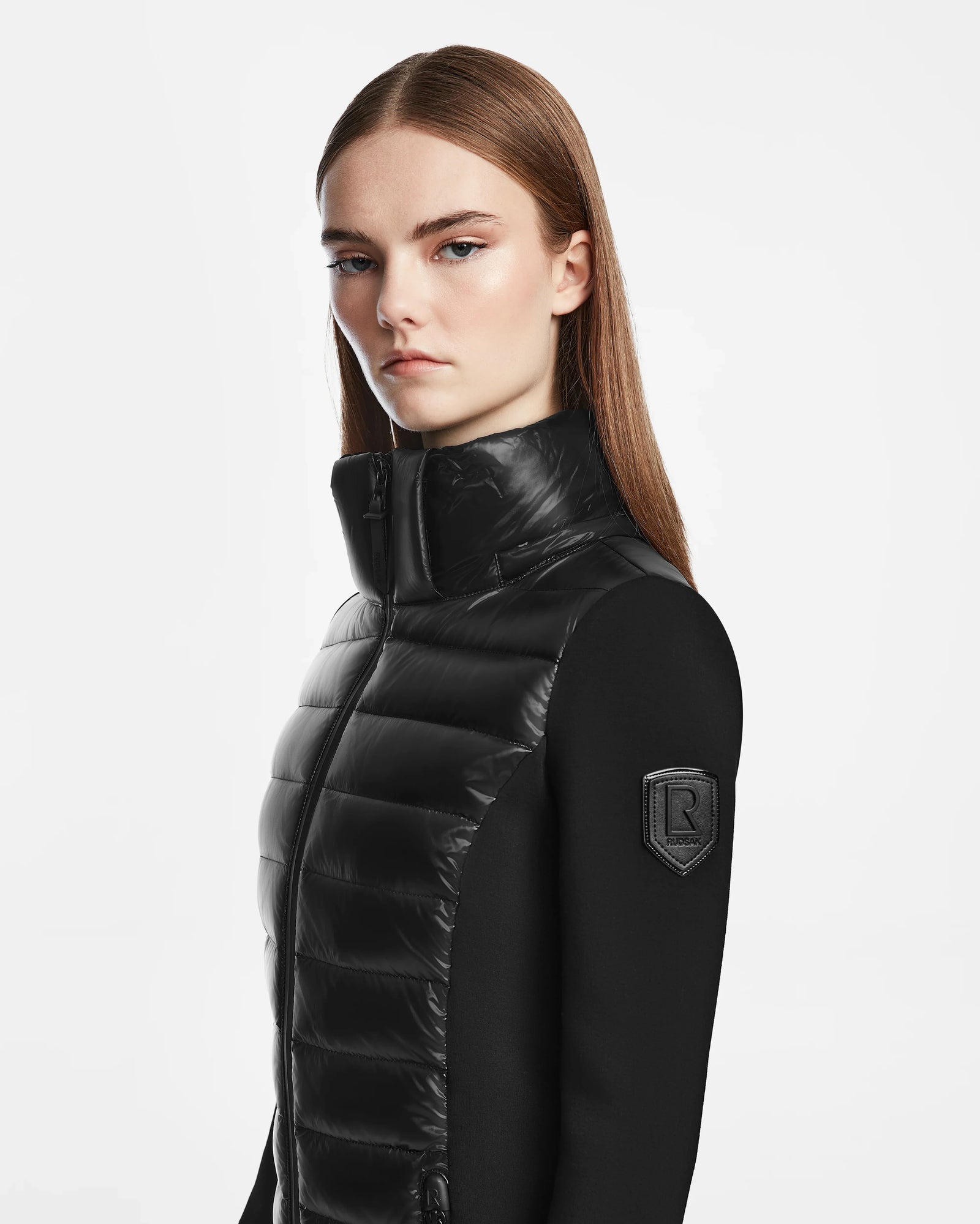 A woman in a sleek black Rudsak MARRY - L121003 puffer jacket.