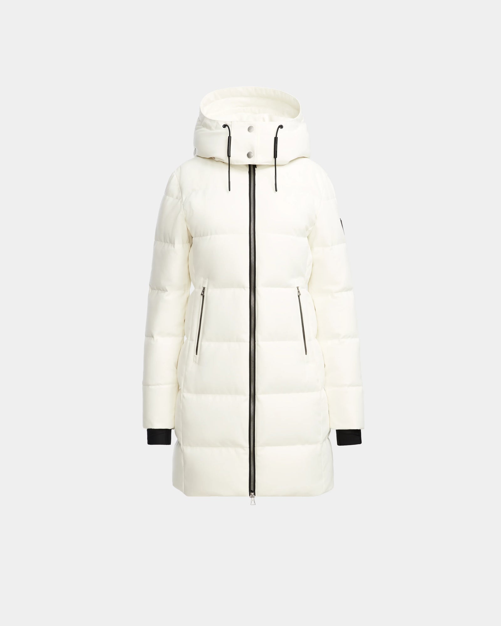 The Rudsak MIRIAM - L123544 Iceland is a white womens knee-length down puffer jacket with a hood, black front zipper, zippered side pockets, and black cuffs, shown on a plain light gray background.