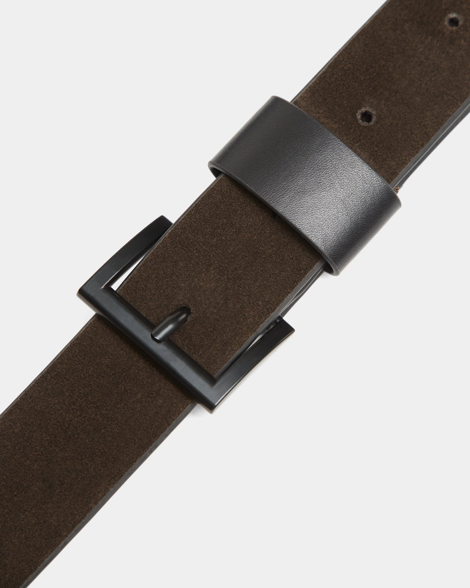 Close-up of the OFILIA S - 8324521 Espresso suede belt by Rudsak, featuring a black rectangular metal buckle and black leather loop—ideal for pairing with your favorite Rudsak accessories.