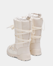 The Rudsak RODIN - 8224502 Iceland womens winter boots feature a tall, off-white design with thick anti-slip soles and wraparound laces, shown from the back on a plain white background.