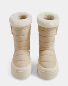 The Rudsak KATHIE - L225516 Vanilla are beige women's mid boots with quilted, padded sides and thick white faux fur lining at the top, shown from the front on a white background.