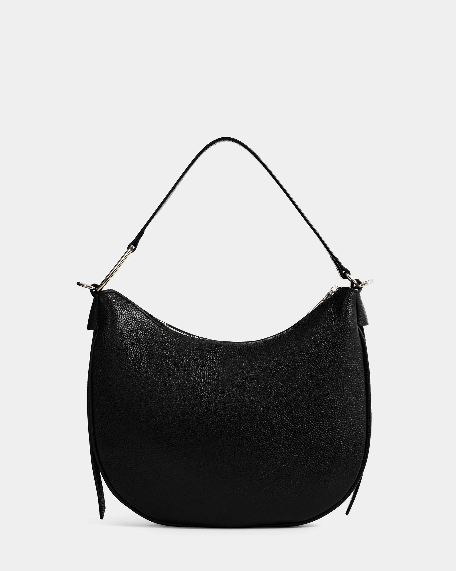 The Rudsak SYLVIA - L325515 Black is a women’s leather shoulder bag with a black crescent silhouette, short single handle, and minimalist design, shown against a plain light gray background.