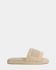 The Rudsak TEDDY - L225517 Vanilla is a beige fuzzy slide sandal with a thick textured vegan-leather strap and sole, ideal for loungewear, shown against a white background.