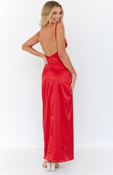 Side view of a red satin maxi dress with a high leg slit and ruched bodice detail