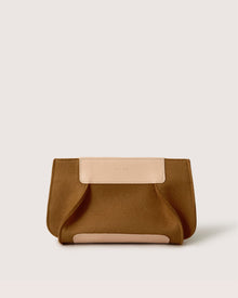 The Graf Lantz brown clutch purse, sustainably crafted from Merino wool with light beige leather accents, rests elegantly on a plain white background.