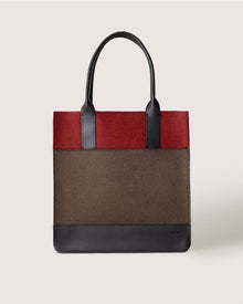 A structured Graf Lantz tote bag with black handles, a dark red top, brown middle section, and black bottom trim is displayed against a plain light background.