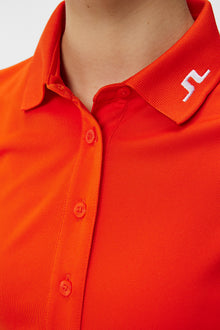 Women | Tour Tech Polo | Tangerine Tango