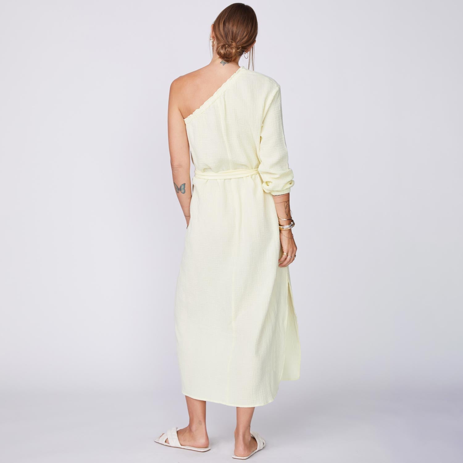 Back View of Model wearing the Gauze One Shoulder Dress in Lemon