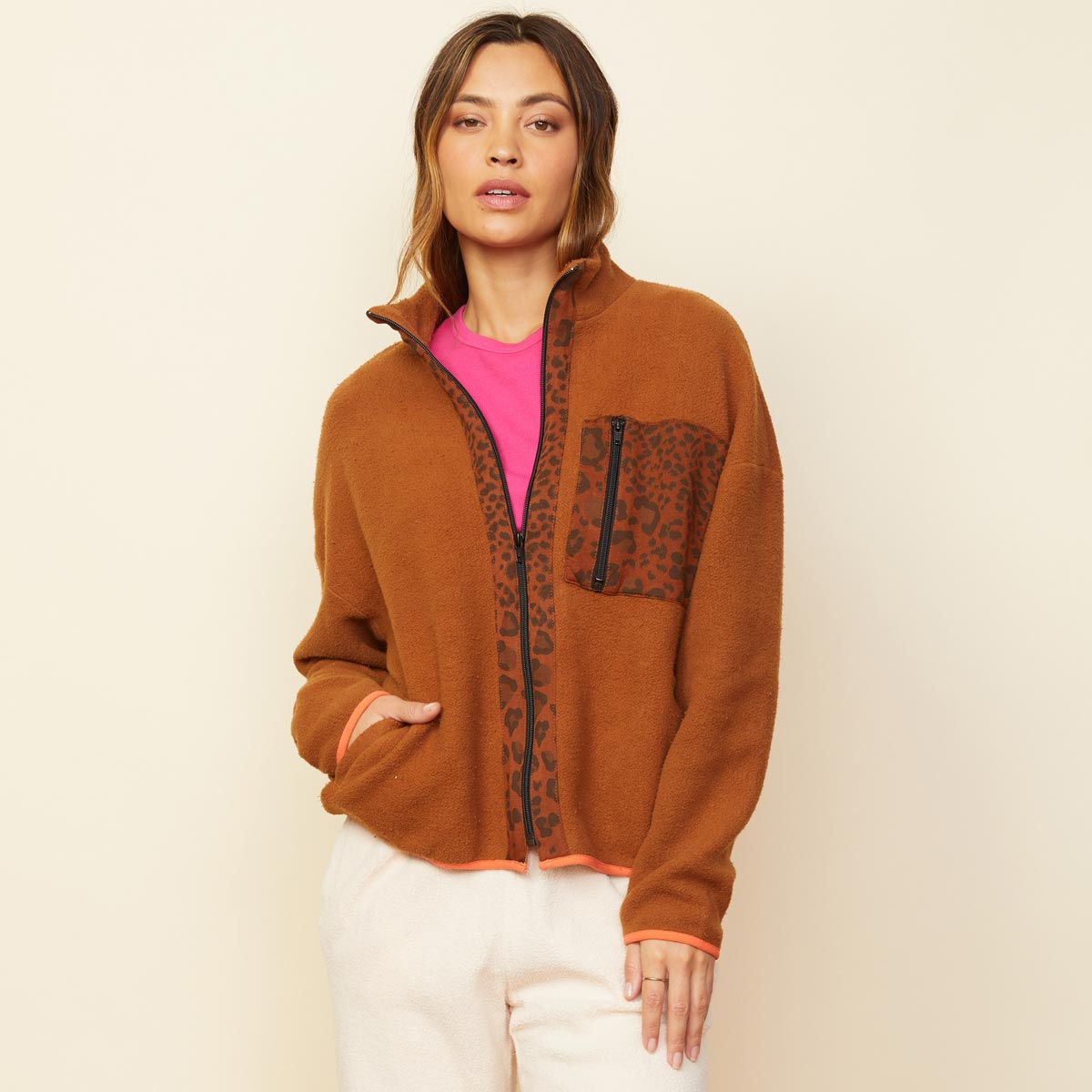 Front view of model wearing the leopard trim fleece jacket in caramel.