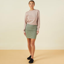 Front view of model wearing the supersoft fold over skirt in laurel green.