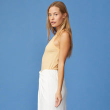 Side View of model wearing the Stripe Narrow Tank in Sand