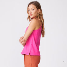 Side view of model wearing the halter tank in raspberry.