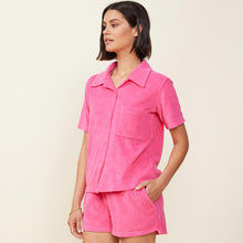 Side view of model wearing the terry cloth pocket shirt in azalea.